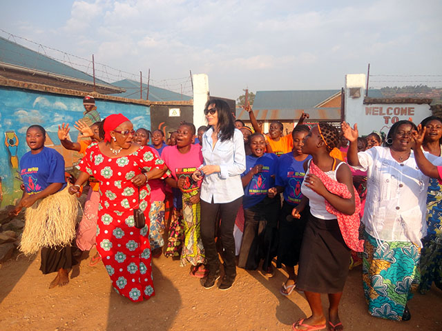 Yasmin Benguigui dances with residents at City of Joy.